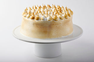 Our vanilla cake, 2 layers of moist vanilla cake, dulce de leche and Italian Meringue