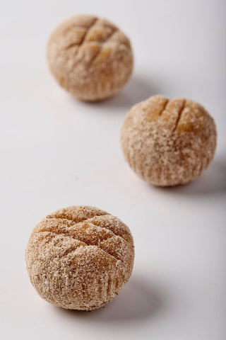 Pecan-cinnamon truffles, crafted with rich homemade manjar de olla, a hint of orange zest, cinnamon  and ground pecans